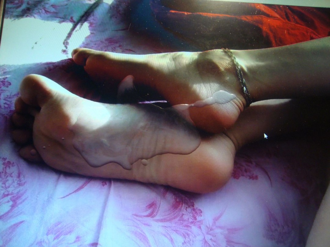 Tender feet of extremely slutty tgirl L. cumshooted by Kurt.jpg